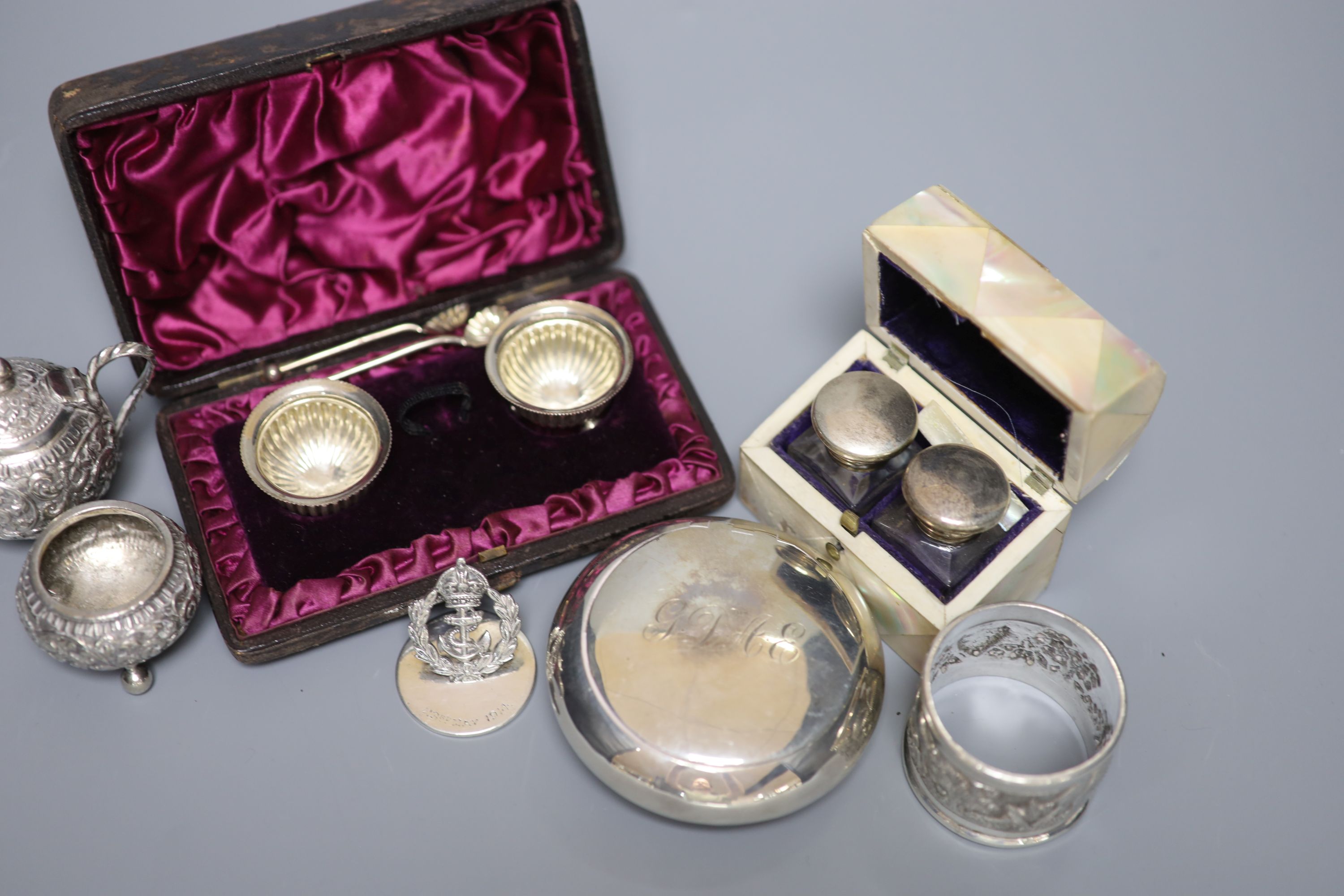 A group of small silverware, including Edwardian tobacco box, London, 1902, a cased pair of salts and a menu holder and other white metal items including Indian.